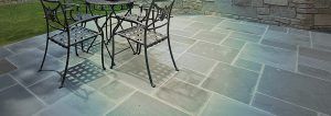 patio with large tiles and dining set